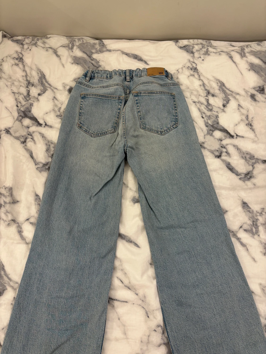 Ljusblå jeans med hål från 157 - 2