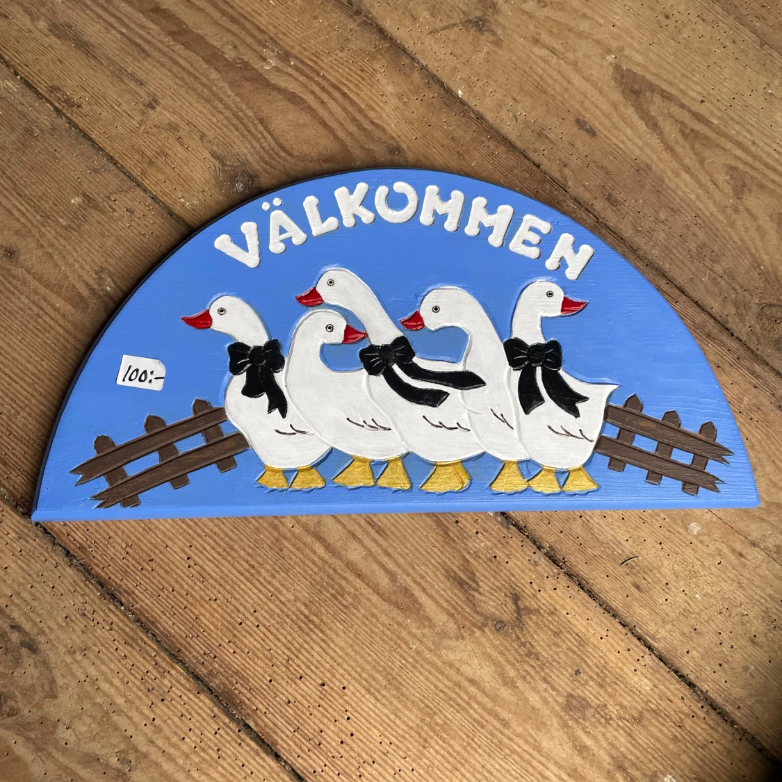 Välkommen-skylt med gäss