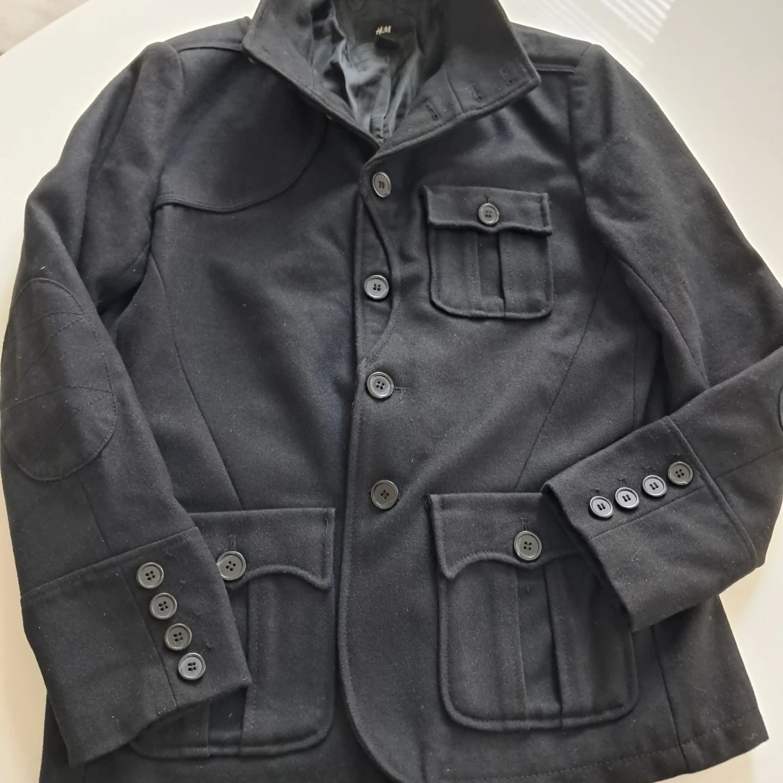 Svart ullkavaj från H&M, strl 52