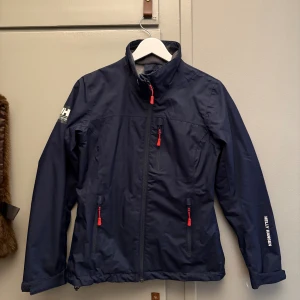 Mörkblå Helly Hansen jacka  - Mörkblå Helly Hansen jacka