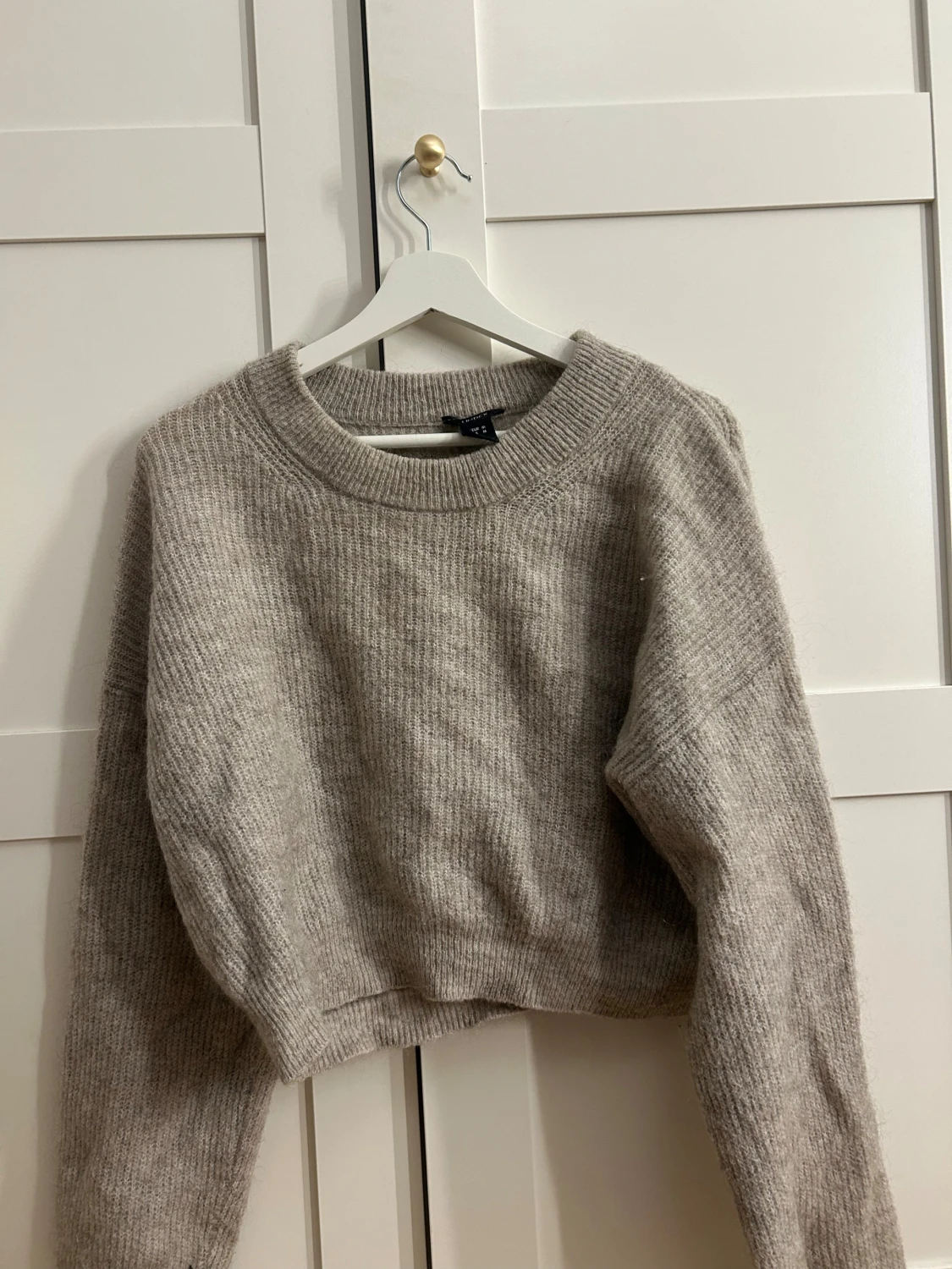 Beige stickad tröja från Lindex