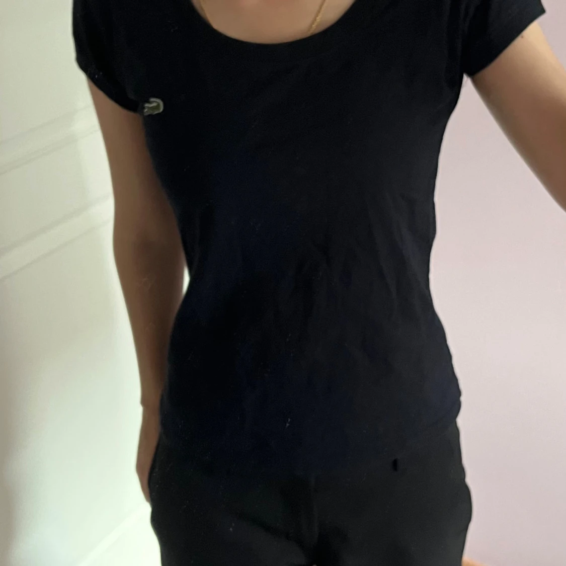 Svart kortärmad topp från Lacoste