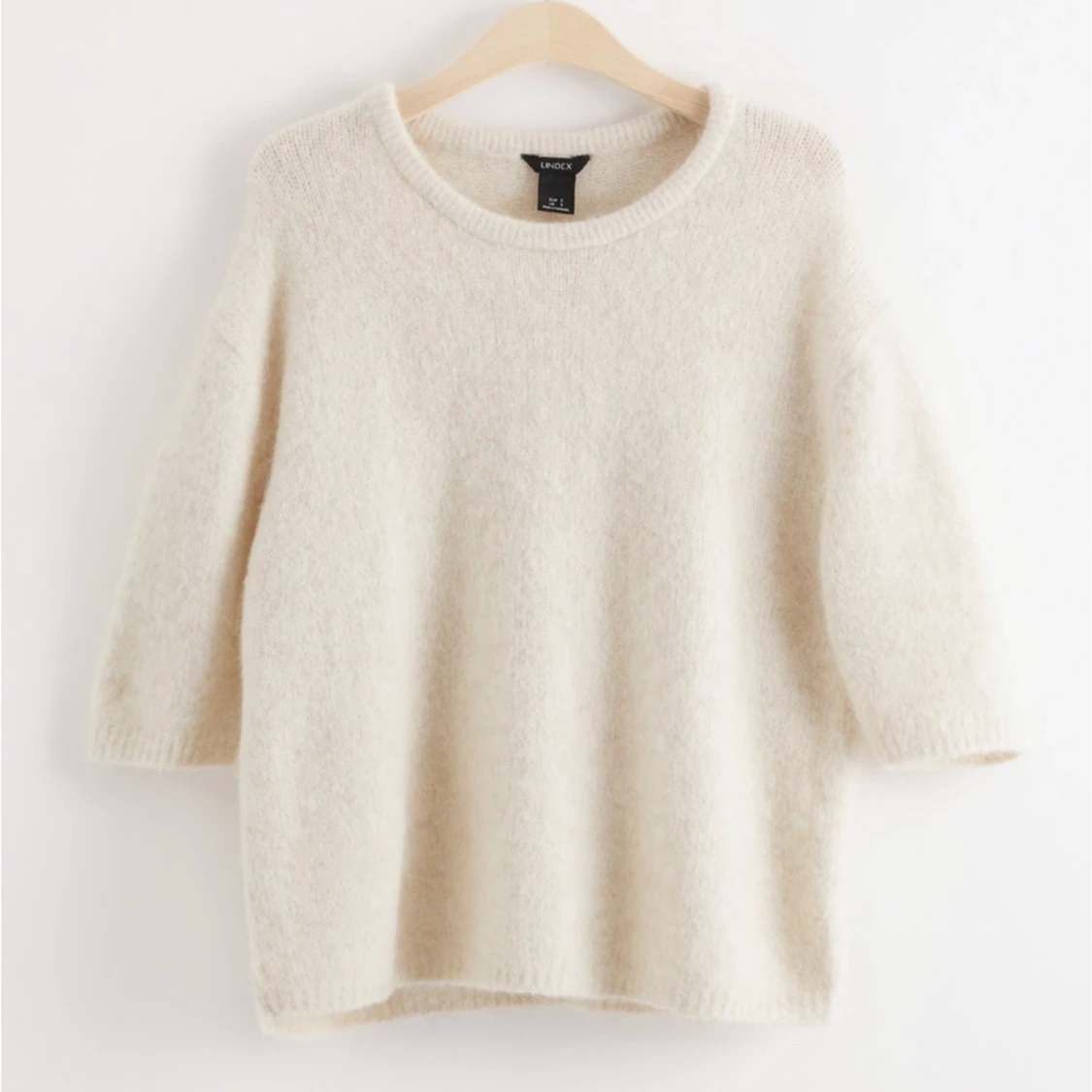 Stickad tröja med trekvartärm