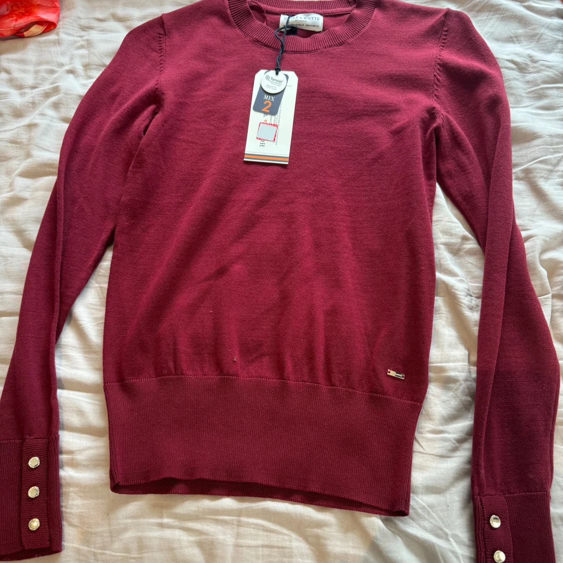 Vinröd stickad tröja från Lindex
