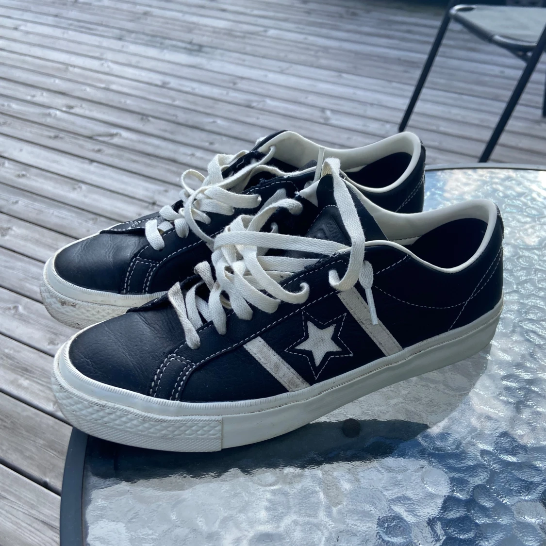 Svarta Converse One Star