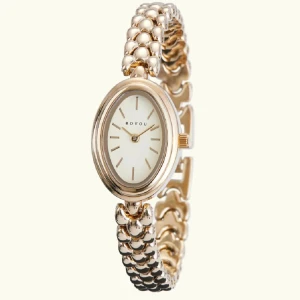 Guldig klocka med kedjelänk och berlocker - Snygg guldig klocka från bouvo med rund urtavla och kedjelänk. Urtavlan är ljus med svarta markeringar och armbandet har små guldberlocker som detaljer. Perfekt accessoar för att lyfta din stil.