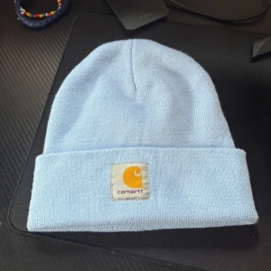 Ljusblå carhartt mössa - Ljusblå carhartt mössa, överlag i mycket fint skick