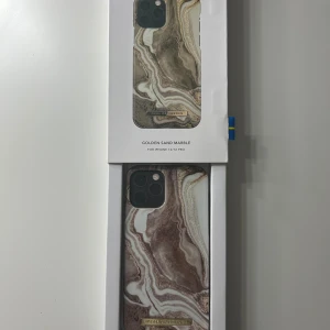 Golden Sand Marble skal från Ideal of Sweden - Snyggt mobilskal i marmormönster från Ideal of Sweden för iPhone 12/12 Pro. 💕💕 Designen heter Golden Sand Marble. Skalet är oanvänt och säljer eftersom jag fått en ny mobil som skalet inte passar på. Skickas i originalkartong och nypris är 350kr 🩷💞