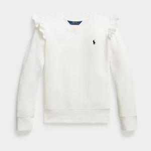 Vit tröja med volangdetaljer från Polo Ralph Lauren - Säljer en stilren vit tröja från Polo Ralph Lauren med volangdetaljer vid axlarna. Tröjan har långa ärmar och en liten broderad logotyp på bröstet. Aldrig använt och säljer pga att den är för liten för mig.