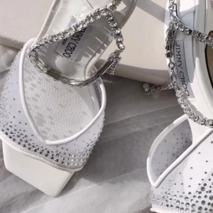 Crystal Slingback Heels – Sparkly Party Shoes (New) - Stand out with these stunning silver slingback heels, covered in shimmering crystal embellishments and featuring a chic pointed toe and elegant ankle strap detail. These shoes are perfect for weddings, parties, or any special occasion where you want to shine. NOTE: Inspired style. These are not original designer shoes.