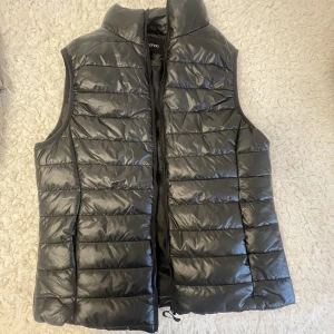 Dun väst - Dun väst storlek s. Använd 1 gång 