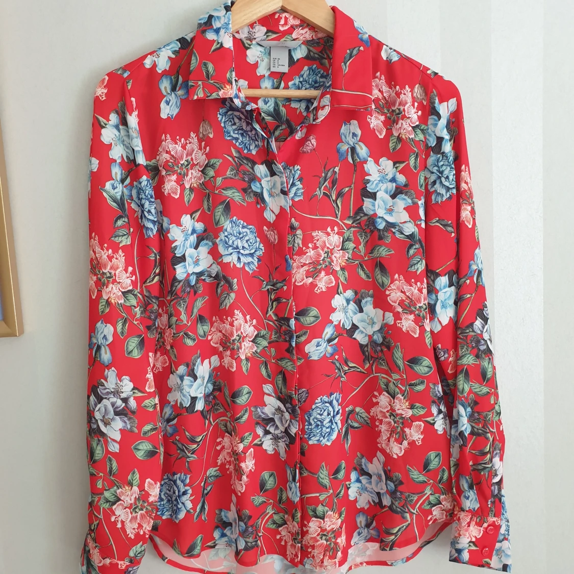 A floral shirt, light fabric, size M