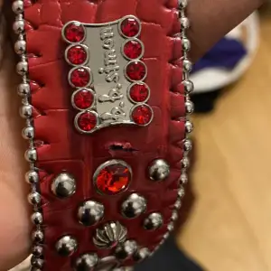 Red BB SIMONS BELT PRICE IS NEGOTIABLE 