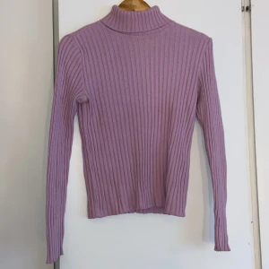 Polotröja - Rosa polotröja i storlek 36/38
