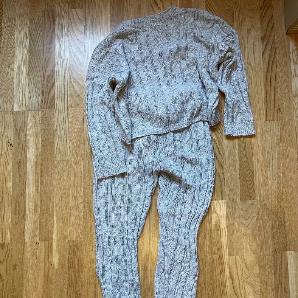 Matching set of  light gray sweater and pants in size M.  Almost new. . Stickat.
