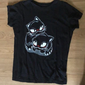 Black t-shirt with print on - Dm if you’re interested: :) 