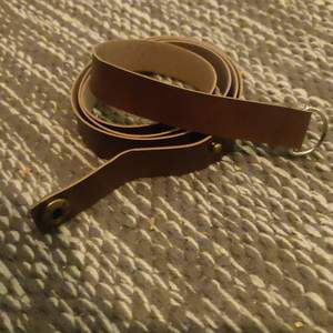 Brown faux leather belt, 100cm. Thin.