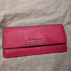 Pink wallet from Michael Kors 