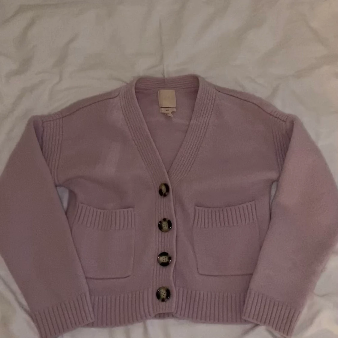 Lila kofta med fickor 