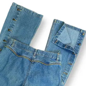 Cute mid rise/high rise Y2K cowboy jeans in good condition 🤠🤎  Buttons along the calves, unbuttoned picture seen in picture three. Size 40  Measurements:Waist width 41cm, Crotch depth 25cm, Hip width 46cm & Inner leg length 75cm