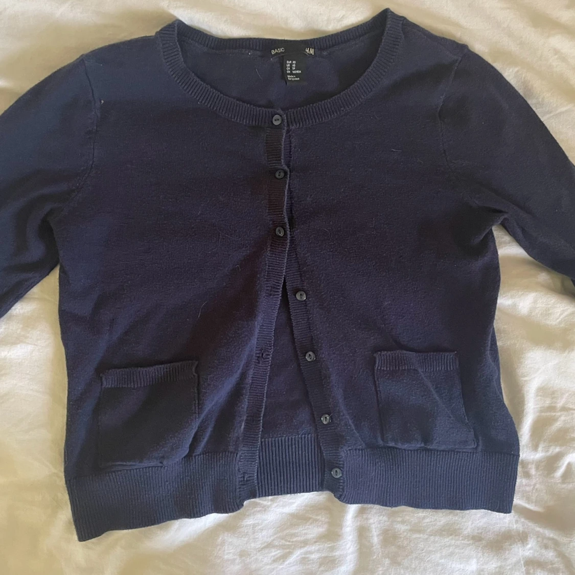 Stickad kofta med fickor  - 90