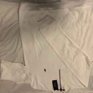 Polo ralph lauren zipper sweater - Color: white Size: L works if you are XL too (little bit big) Care label: Not recommended to machine wash if, (hand wash it). The material is really sensitive.  Comes with tags and the bag (Polo ralph lauren)