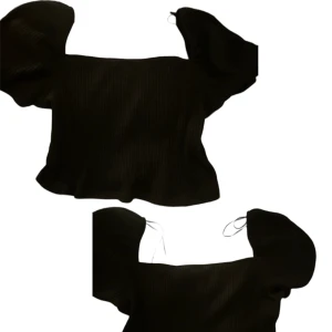 Svart puffaxlad topp  - Så fin topp men den är tyvärr för stor för mig. 