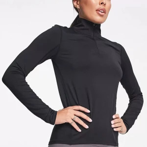 Långärmad träningströja 1/4 dragkedja - Långärmad half zip träningströja som endast är använd två gånger! Helt slutsåld!