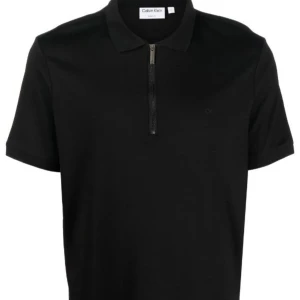 CK Piké - Skit snygg Calvin Klein zip pike. Säljer eftersom den inte passar längre. Storlek L men passar M, nypris 1099kr.