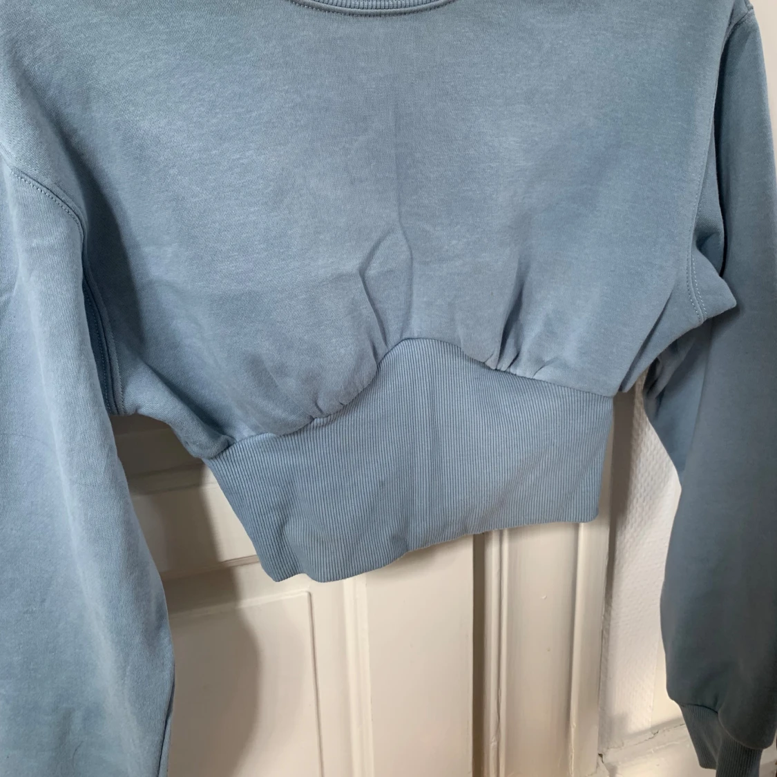 Ljusblå tröja - 91