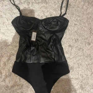 Body - Aldrig använd med prislapp. Strl XS