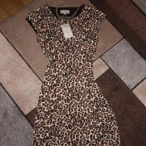 A Leopard dress - New dress with tags never used 