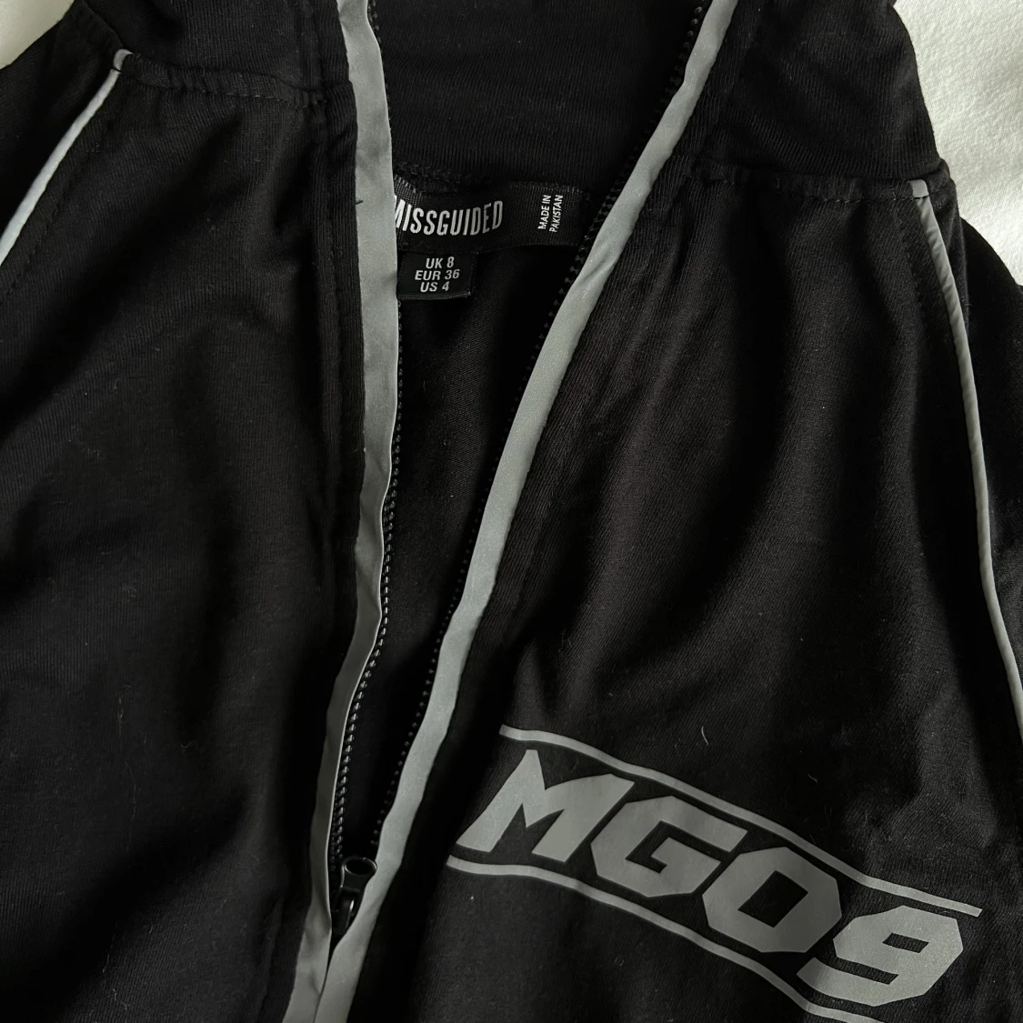 Topp med reflexiva detaljer  - 91