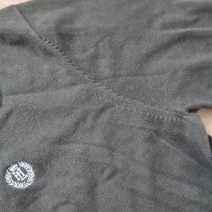 snygg grön stickad tröja - snygg stickad mörk grön tröja från Henri lloyd