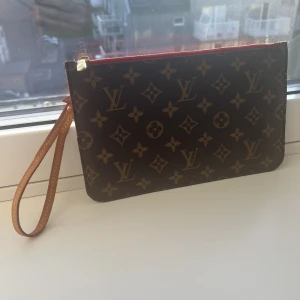 Neverfull cloth clutch bag  - Neverfull cloth clutch bag.