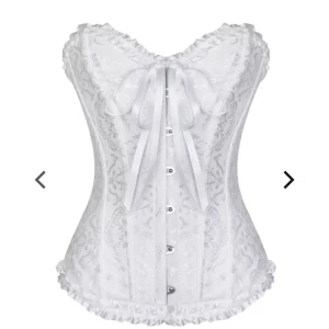 Vit korsett - Säljer denna helt oanvända korsett från Toplady i storlek M men på hemsidan står det storlek 34/36.