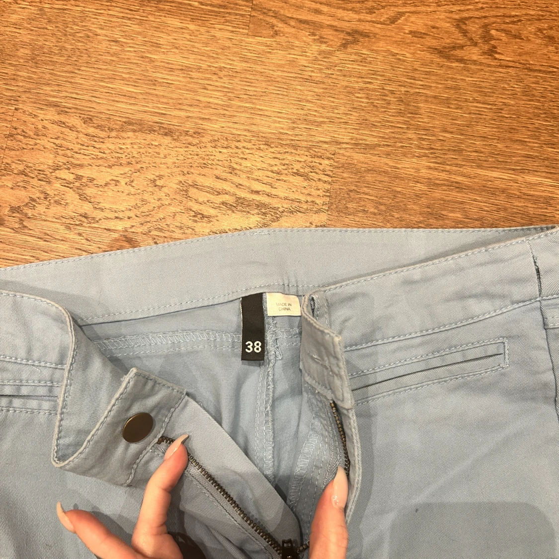 Ljusblåa byxor  - 90