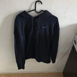 Blå hollister hoodie med dragkedja