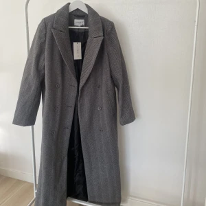 Kappa nakd  - Oanvänd kappa från nakd med lapparna kvar, storlek 34 men är lång och stor i storleken. 