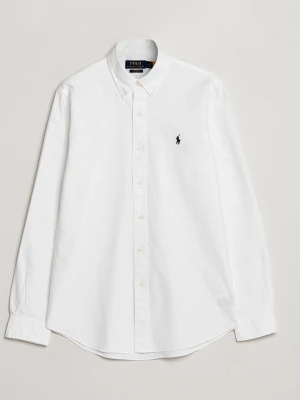 Vit skjorta från Polo Ralph Lauren - Klassisk vit skjorta från Polo Ralph Lauren i bomull med lång ärm och knappar framtill. Skjortan har en broderad logga på bröstet och normal passform. Perfekt till en clean och stilren look.