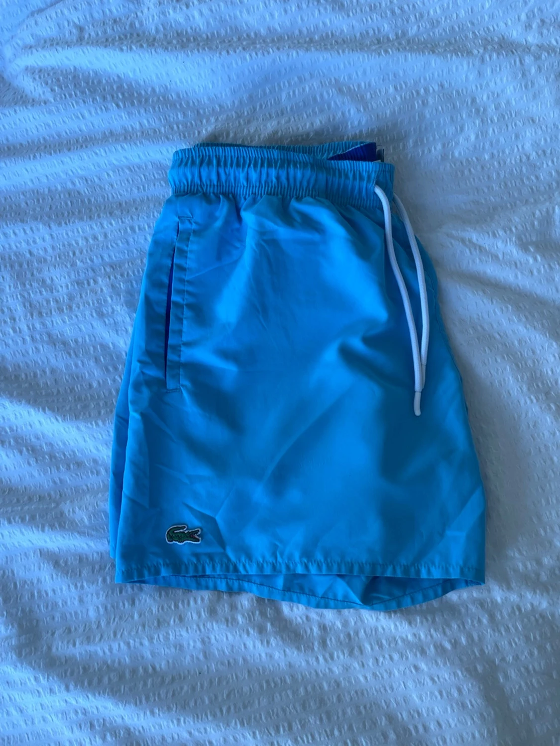 Blå badbyxor från Lacoste