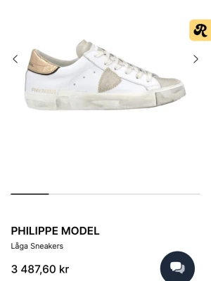 Philippe Model vita sneakers med guld - Snygga vita sneakers från Philippe Model. Knappt använda och sulan är oanvänd