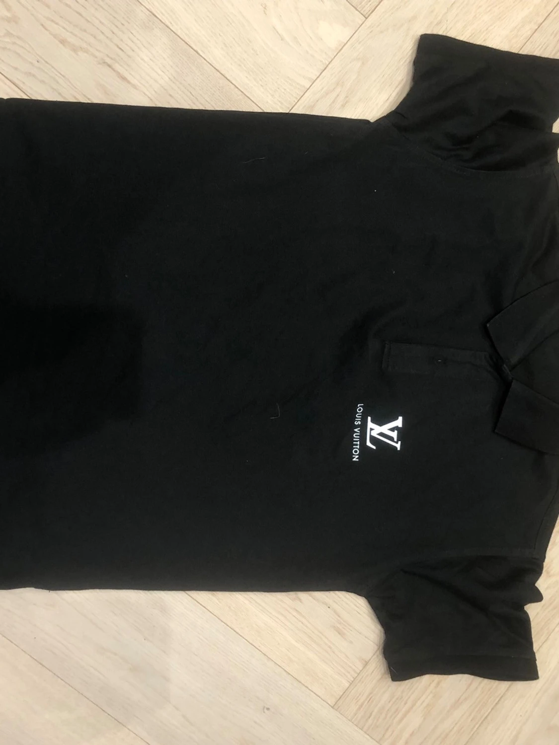 Svart pikétröja från NOLIMITATION