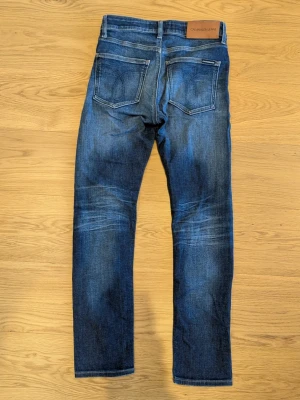 Calvin Klein Jeans - Ett par otroligt snygga och fina blå jeans från Calvin Klein i storlek 30/30. Ställ gärna frågor vid funderingar!😊