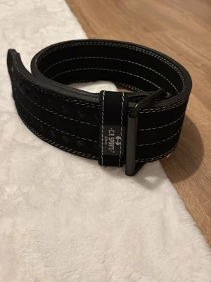 Lyftarbälte  - Så gott som nytt, Stl L , men finns många hål så passar dom flesta 