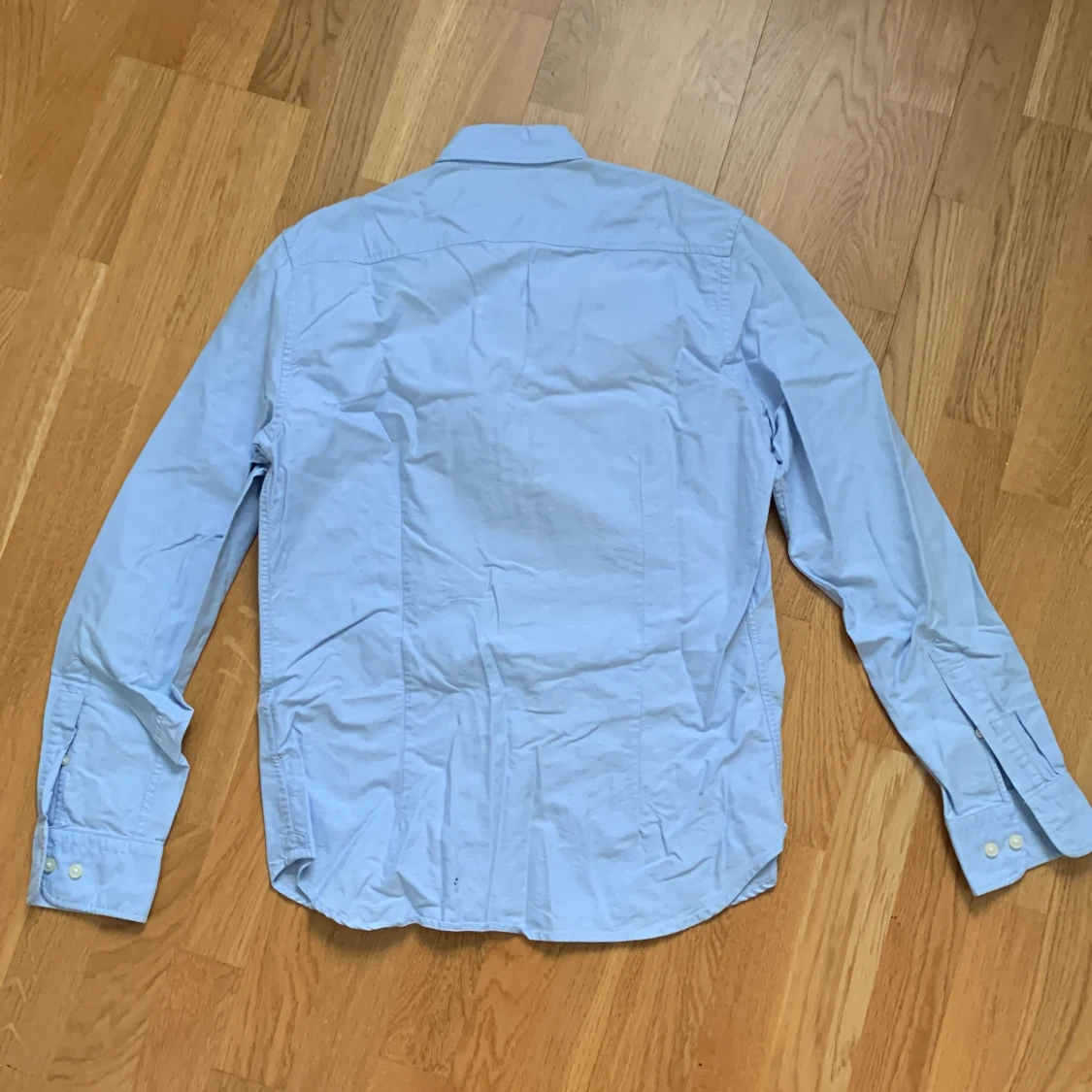 Ljusblå skjorta - 91