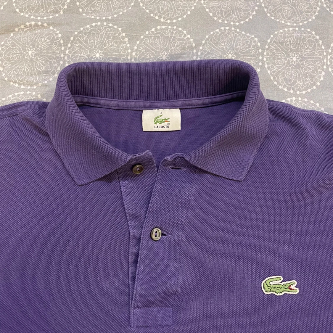 Lila pikétröja från Lacoste - 90