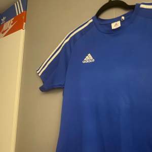 Blue adidas training shirt used but still good quality size M but fits L and i am open for price negotiation.