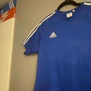 Blue Adidas training/compression t-shirt size M-L - Blue adidas training shirt used but still good quality size M but fits L and i am open for price negotiation.