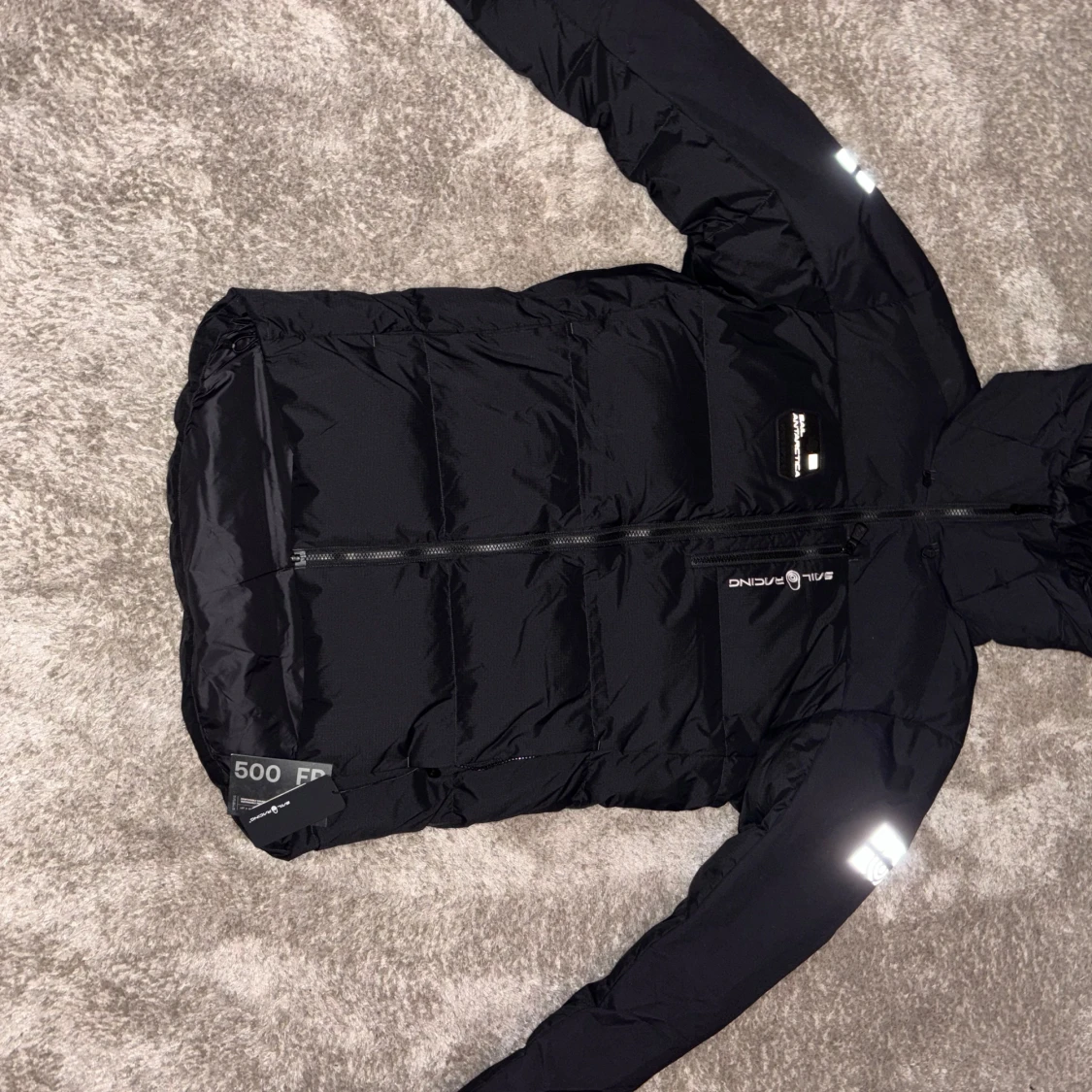 Svart dunjacka från Sail Racing 